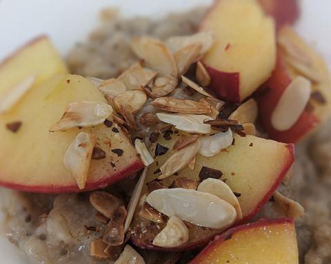 Illustrative photo: Oatmeal topped with fresh apple slices and flaked almonds