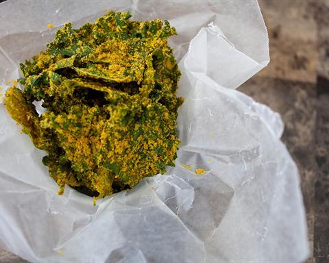 Illustrative photo: Baked kale chips seasoned with nutritional yeast and spices