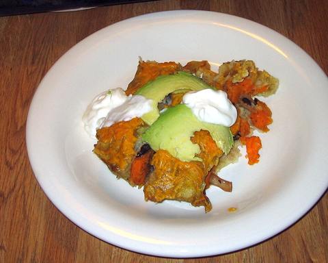 Illustrative photo: Sweet potato and black bean enchiladas topped with avocado and sour cream