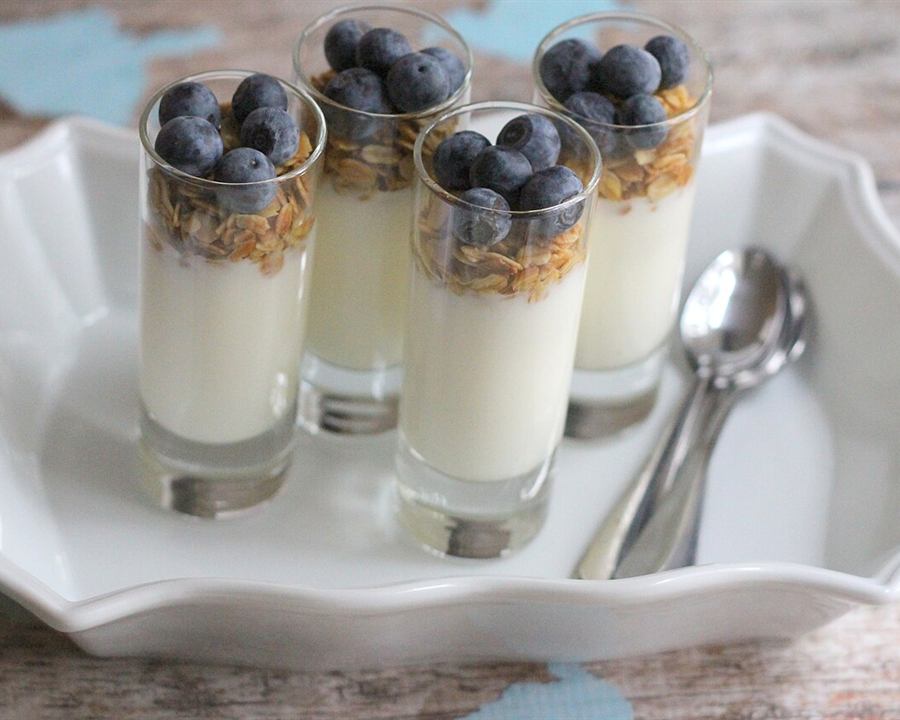 Illustrative photo: Yogurt parfaits with granola and blueberries in small glasses