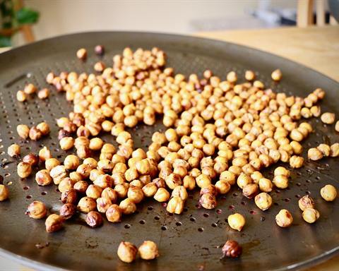 Illustrative photo: Roasted chickpeas spread on a baking tray