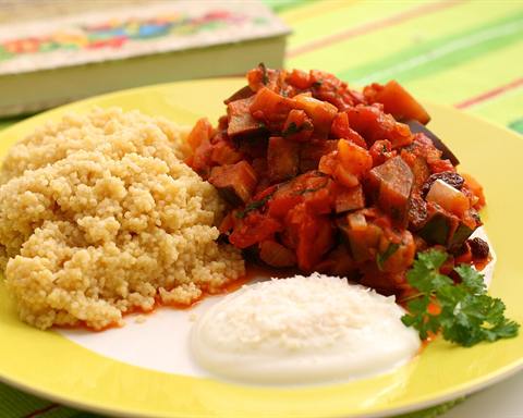 Illustrative photo: Couscous served with aubergine (eggplant) chutney and a spoon of yogurt