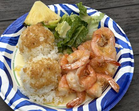 Illustrative photo: Garlic butter shrimp served with rice and a green salad