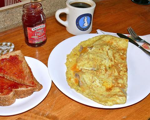 Illustrative photo: An omelette with onions and mushrooms, served with whole-wheat toast and jam