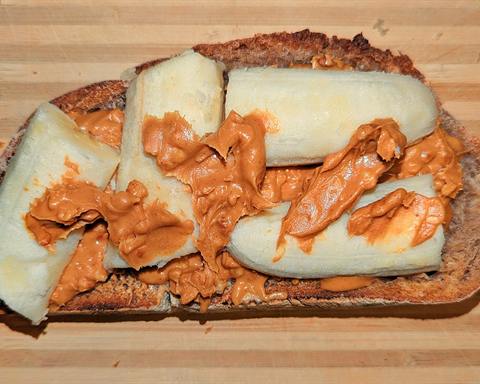 Illustrative photo: Toasted bread spread with peanut butter and topped with banana slices