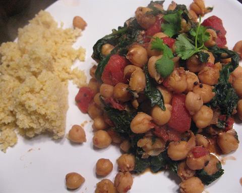 Illustrative photo: Chickpeas and spinach cooked in tomato, served next to couscous