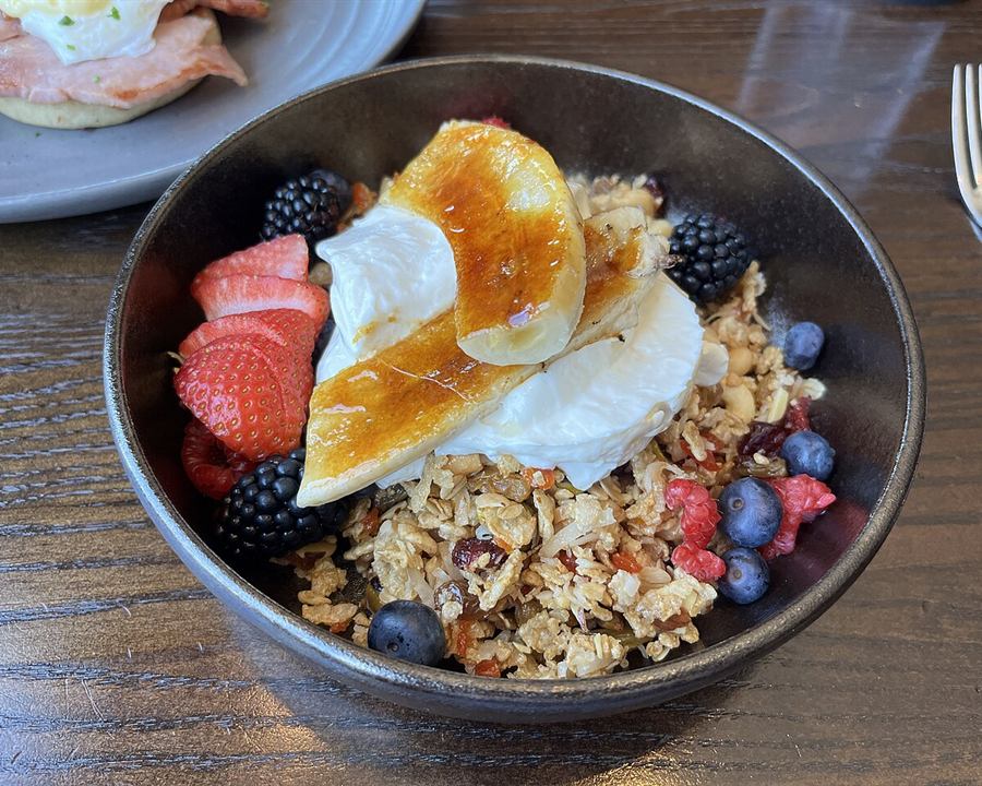 Illustrative photo: A bowl of yogurt with granola, strawberries, blueberries and caramelized banana
